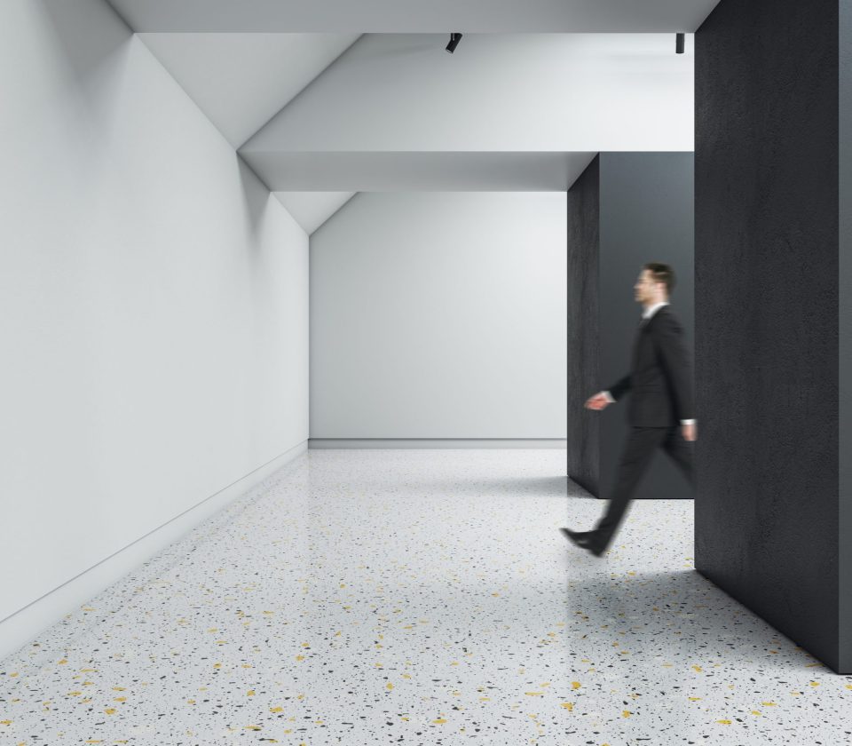 businessman-walking-in-creative-concrete-exhibitio-2026-01-11-08-33-29-utc