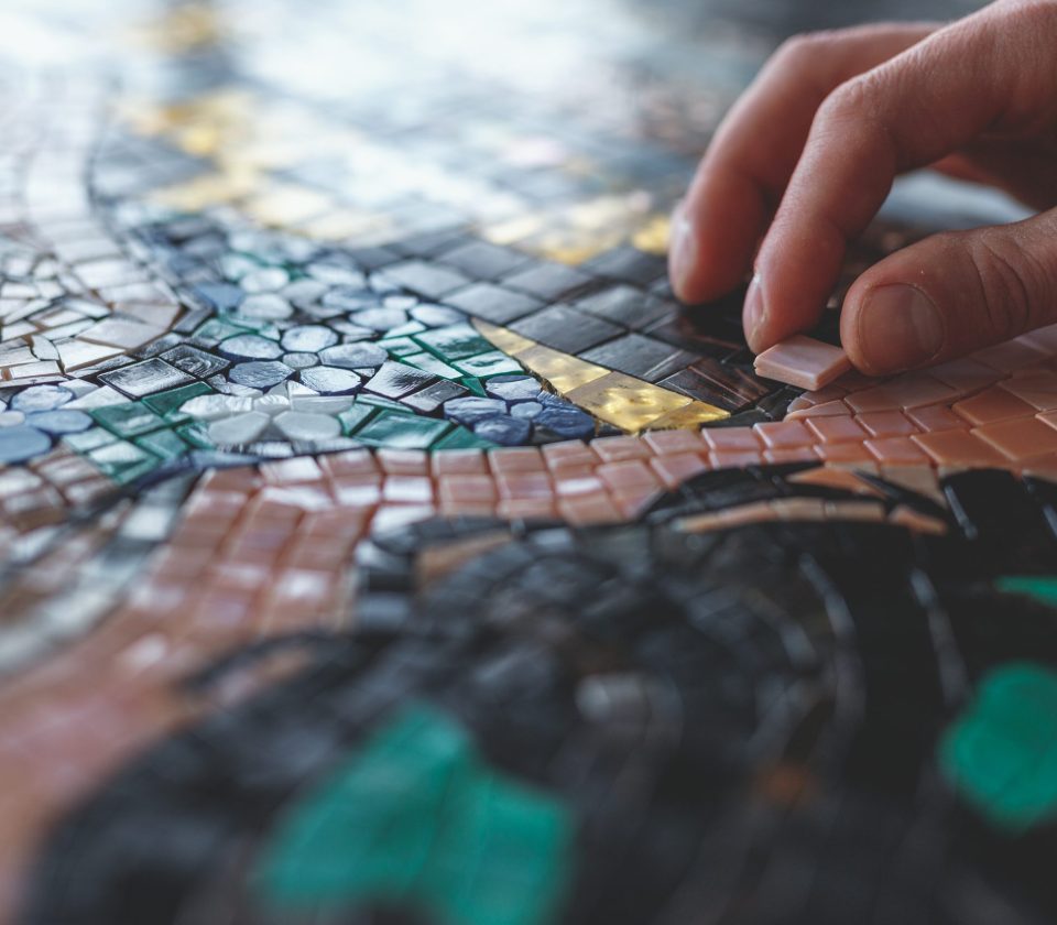 Men's hands with mosaic